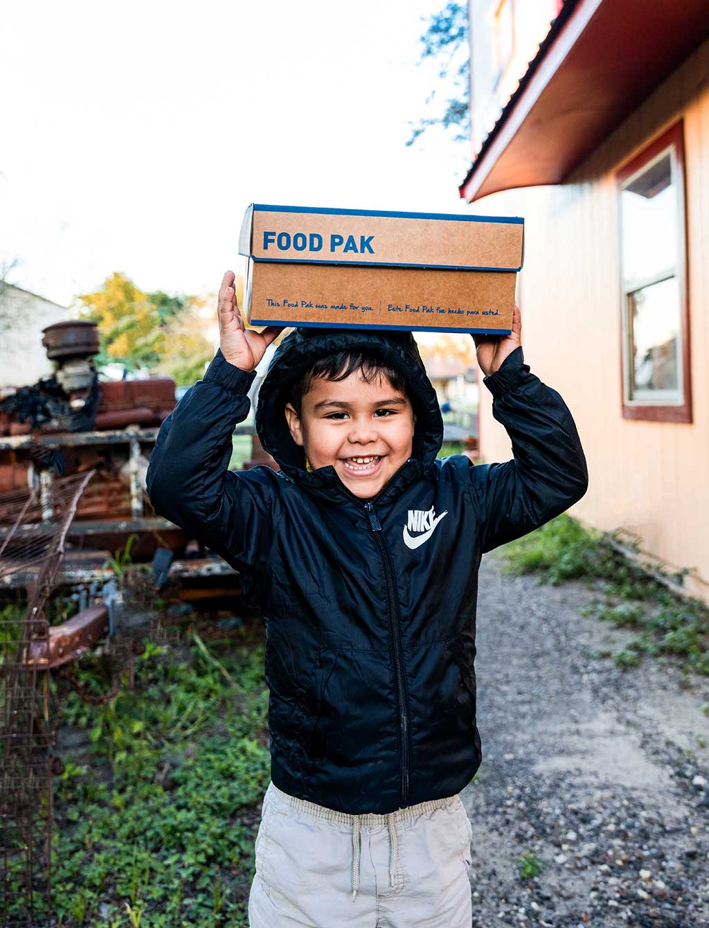 Children's Hunger Fund: Boy with Fook Pak on his head