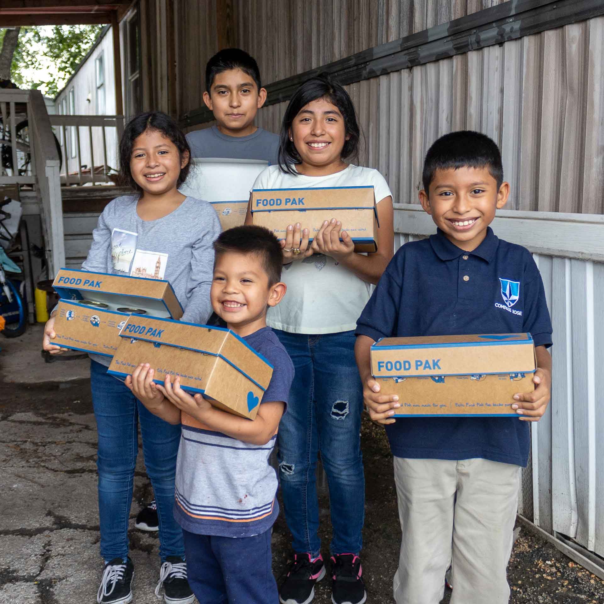 Giving Tuesday - Kids with Food Pak