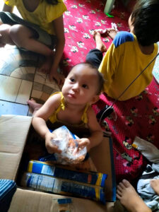 A family receiving a Food Pak.