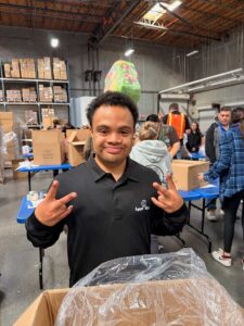 Volunteer packing a box