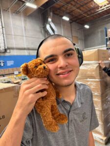 Volunteer holding a stuffed toy