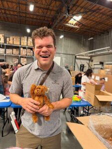 Volunteer holding a stuffed toy